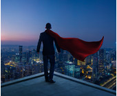 Businessman mit Cape und Stadt im Hintergrund