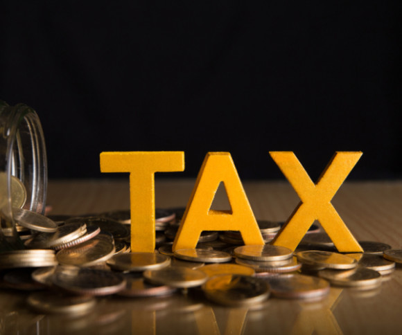Tax-Buchstaben auf Kleingeld 