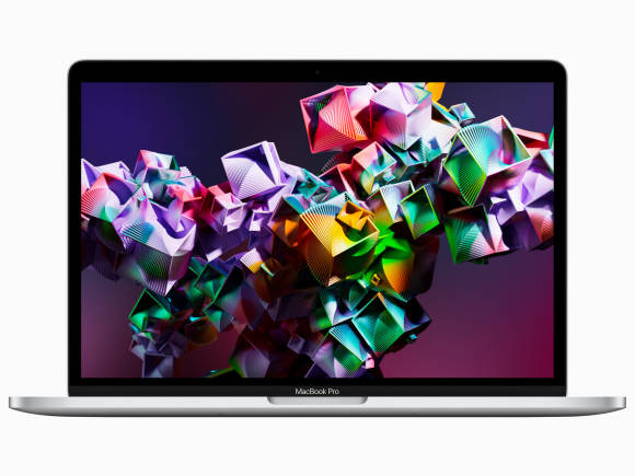 Das Foto zeigt ein neues MacBook Pro mit aufgeklapptem Display, auf dem eine abstrakte Grafik zu sehen ist 