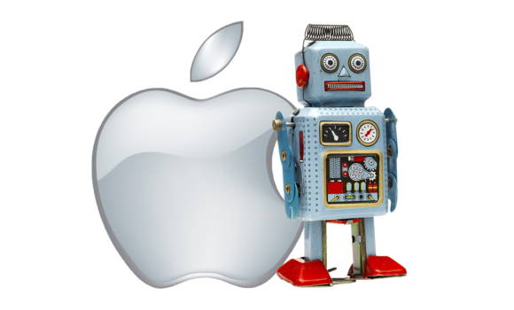Symbolbild. Ein Aufzieh-Roboterspielzeug vor einem Apple-Logo 