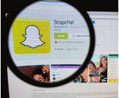 Snapchat-Webseite mit Lupe